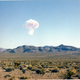 “This photo view of the emerging mushroom cloud explosion, rising from behind the mountain comes from the nuclear museum in Albuquerque. I think the photo was taken near the Nellis Air Force Base or some village in the state of Nevada. The photo was not identified by the museum, I myself determined that it was an Encore explosion, 27 kilotons, in 1953.” -Alexander Mikhalchenko